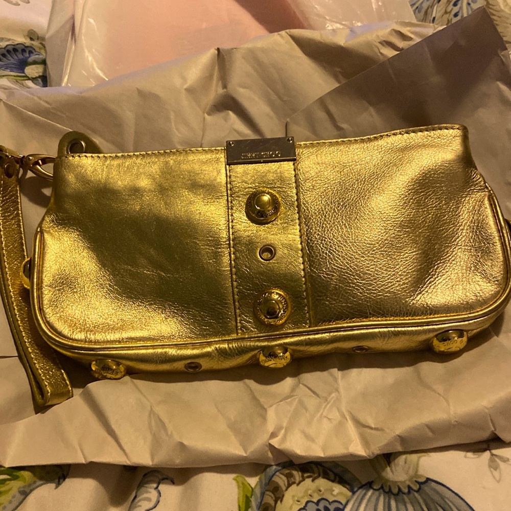 Jimmy Choo Gold Hand Clutch. Such a great piece!